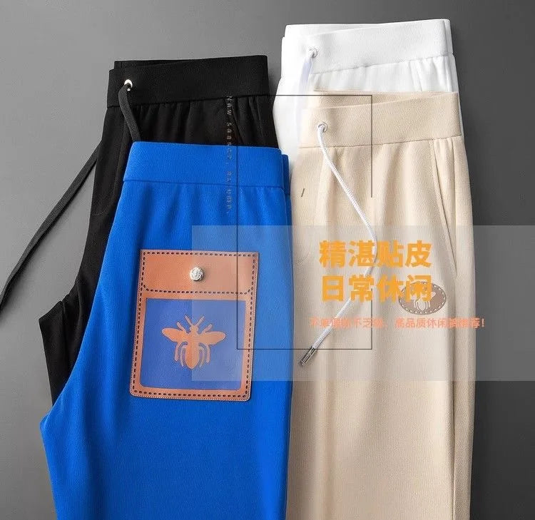 Men's Brand Light Luxury Embossed Casual 9-point Pants 2024 Summer New Silk Smooth Breathable Solid Color Fashion Sports Pants