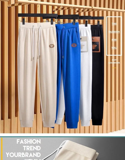 Men's Brand Light Luxury Embossed Casual 9-point Pants 2024 Summer New Silk Smooth Breathable Solid Color Fashion Sports Pants